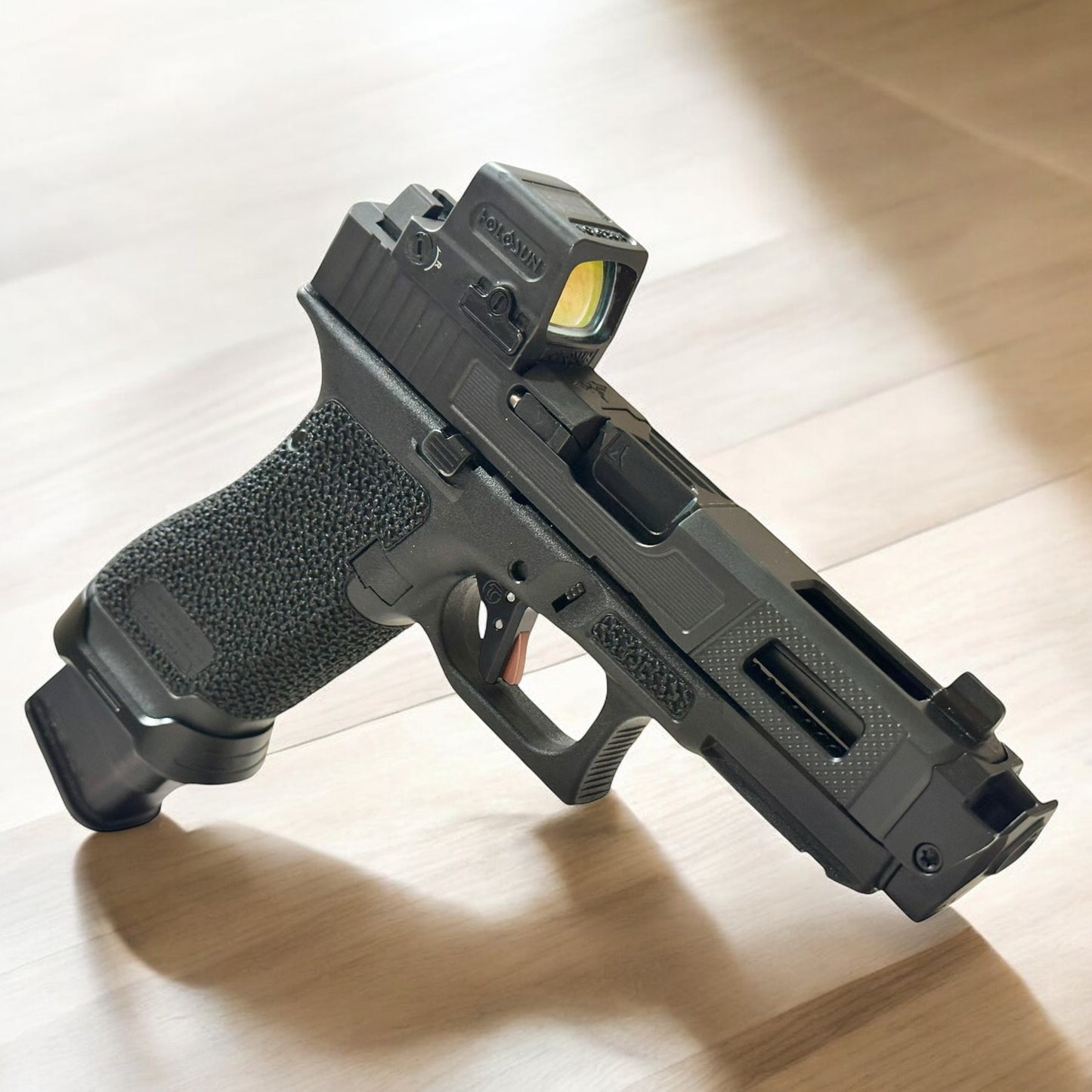 FULLY CUSTOMIZED RADIAN ARMS GLOCK 45 COMPENSATED WITH HOLOSUN AND TIMNEY TRIGGER ALPHA GOLD (pre owned)