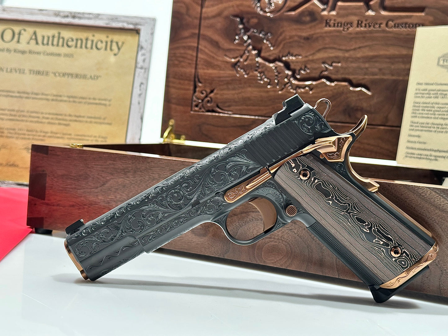 KINGS RIVER CUSTOM LEVEL III; CUSTOM WOOD DISPLAY CASE. HAND ENGRAVED POLISHED DLC/ COPPER FINISH .45ACP