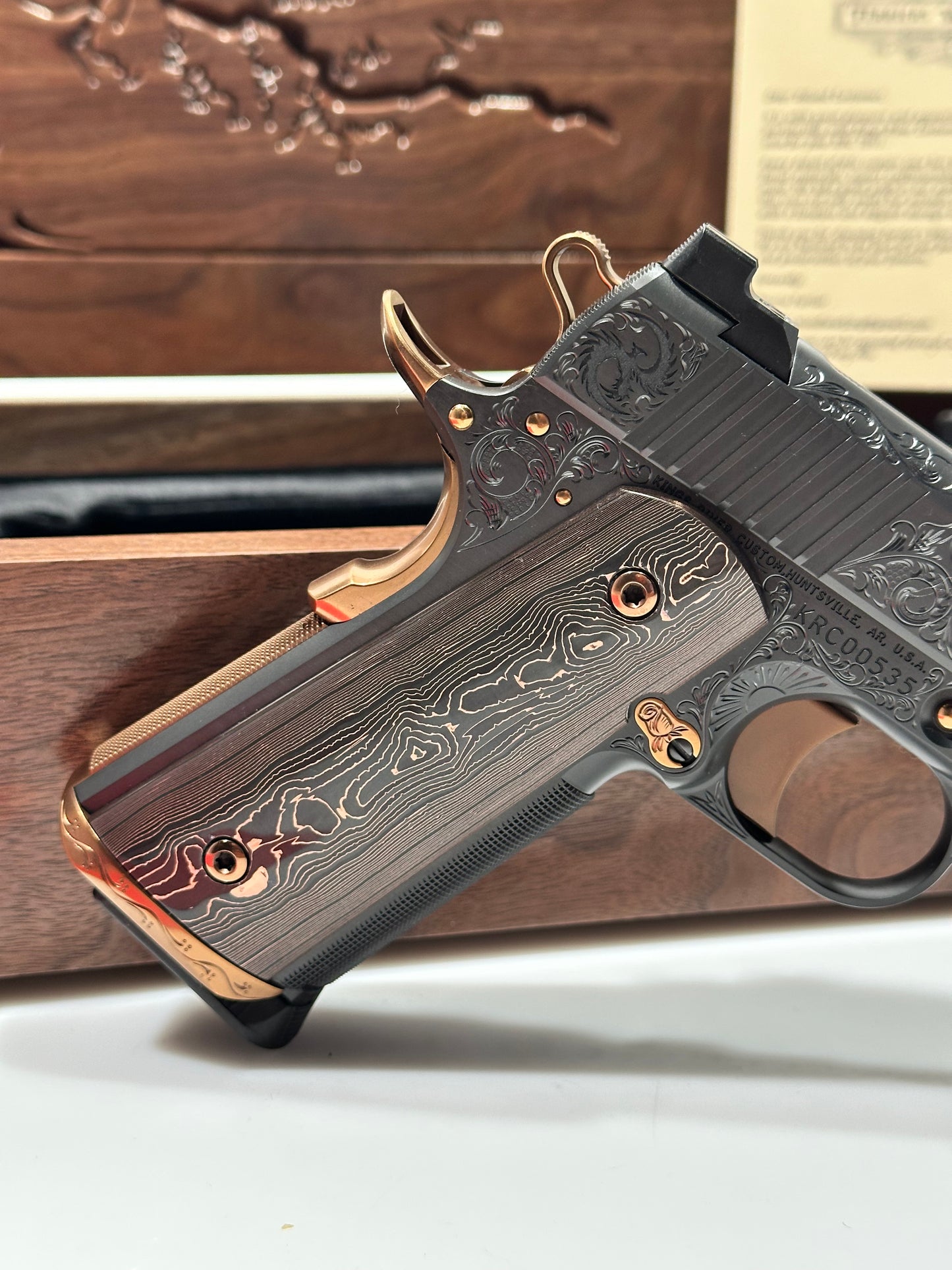 KINGS RIVER CUSTOM LEVEL III; CUSTOM WOOD DISPLAY CASE. HAND ENGRAVED POLISHED DLC/ COPPER FINISH .45ACP