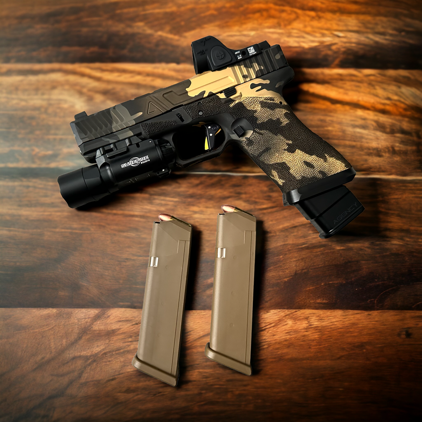 AGENCY ARMS GLOCK 17 MULTI CAM BLACK & GOLD WITH TIMNEY (PRE OWNED)