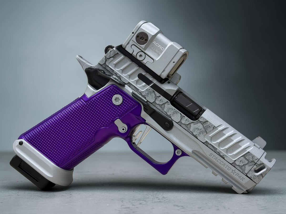 STACCATO CUSTOM P4X “ROCKS” ENGRAVED WITH EDGE TRIGGER, AL GRIPS AND AIMPOINT ACROSS P2
