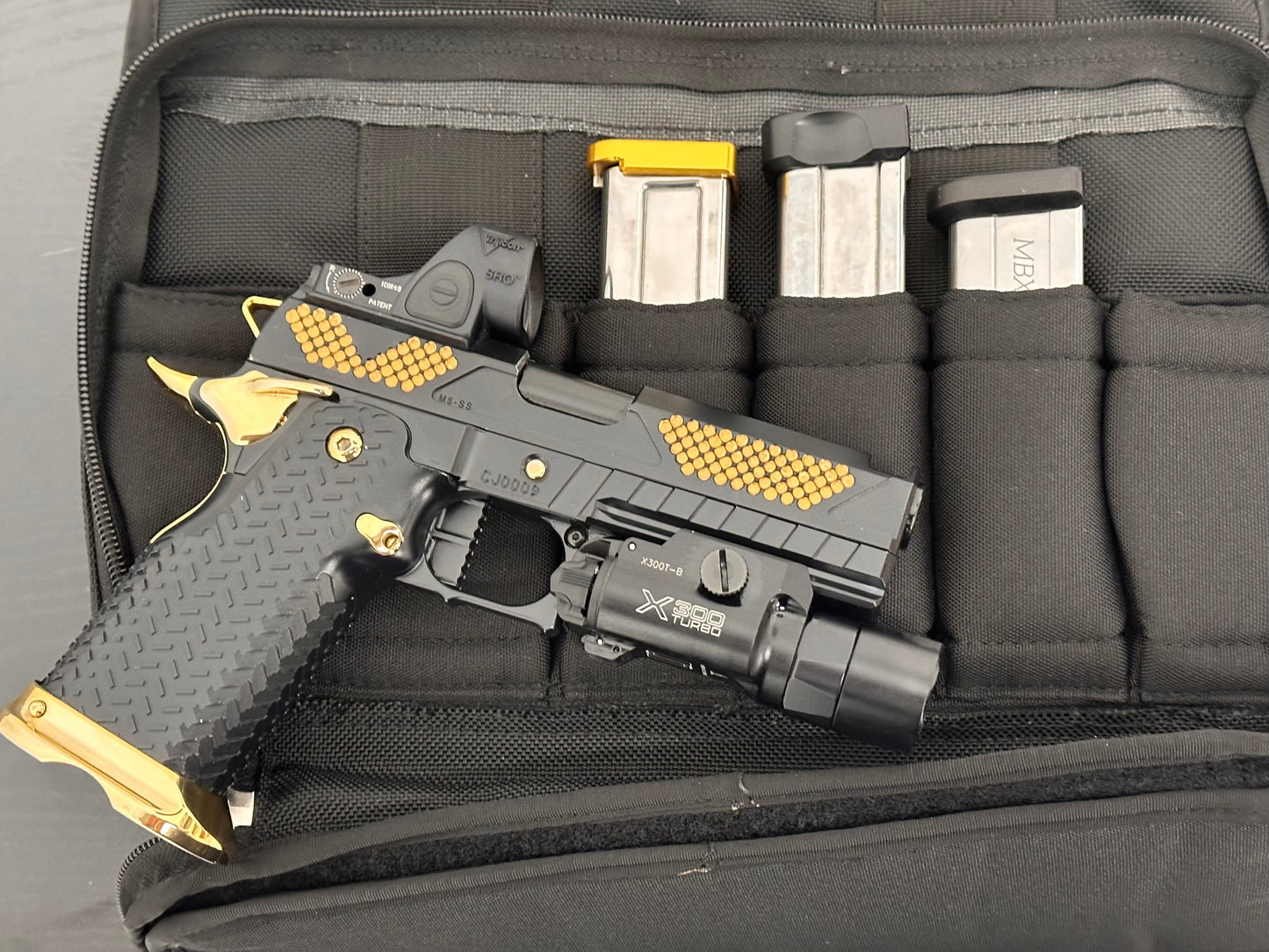 COMBAT PRECISION M5 CUSTOM 2011 PORTED WITH TRIJICON SRO & X300 9MM (Pre owned)