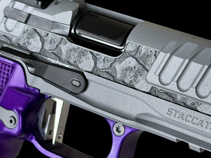 STACCATO CUSTOM P4X “ROCKS” ENGRAVED WITH EDGE TRIGGER, AL GRIPS AND AIMPOINT ACROSS P2